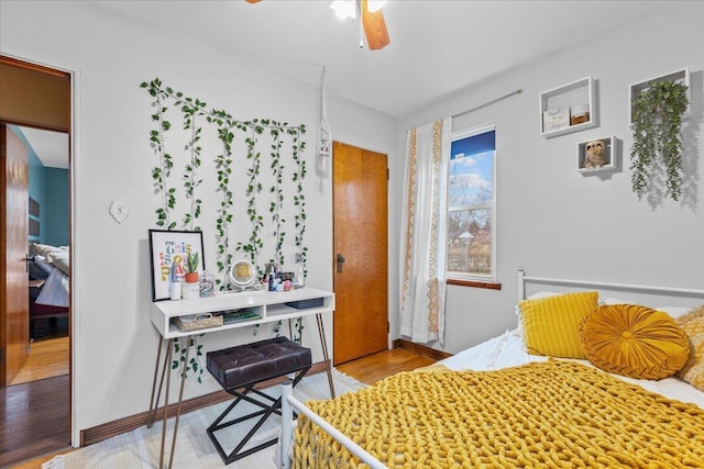 bedroom featuring hardwood / wood-style flooring and ceiling fan