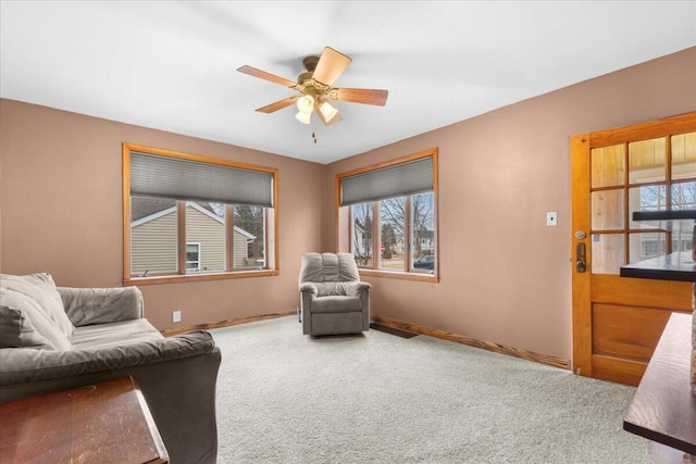 sitting room featuring carpet flooring and ceiling fan