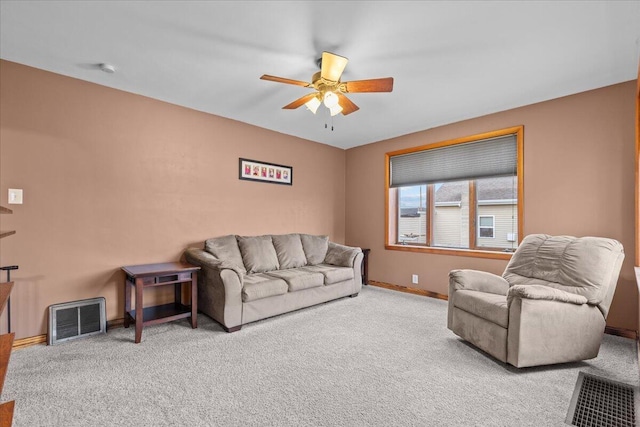 living room with light carpet and ceiling fan