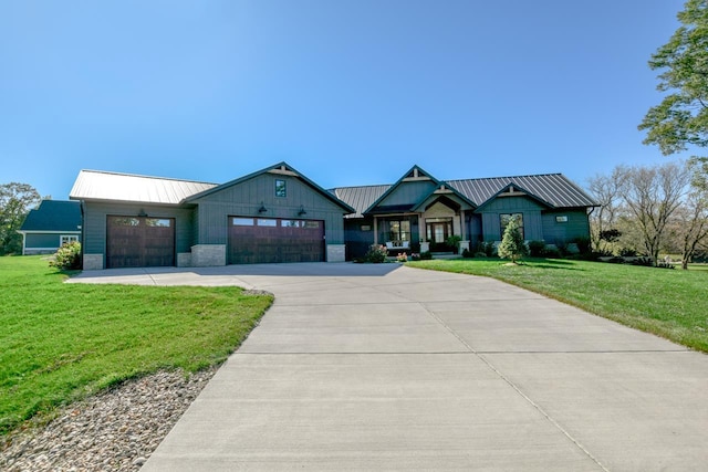 view of front of property with a garage and a front yard