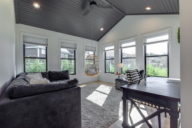 living room featuring ceiling fan, lofted ceiling, wood ceiling, and light hardwood / wood-style floors