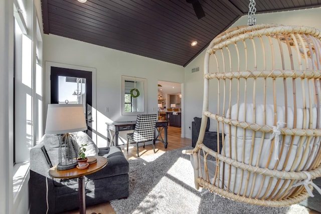 living room featuring vaulted ceiling, wooden ceiling, and light wood-type flooring