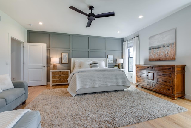 bedroom featuring ceiling fan and light hardwood / wood-style flooring