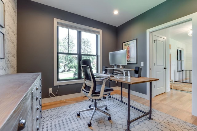 office space with light hardwood / wood-style flooring