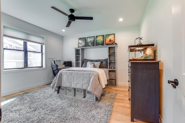 bedroom featuring ceiling fan and light hardwood / wood-style flooring