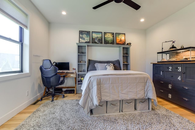 bedroom featuring ceiling fan and light hardwood / wood-style flooring