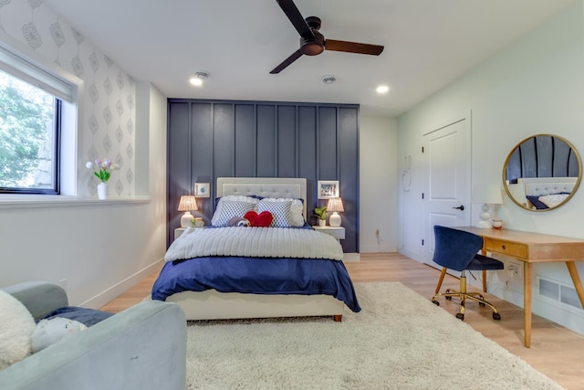 bedroom featuring ceiling fan and light hardwood / wood-style flooring