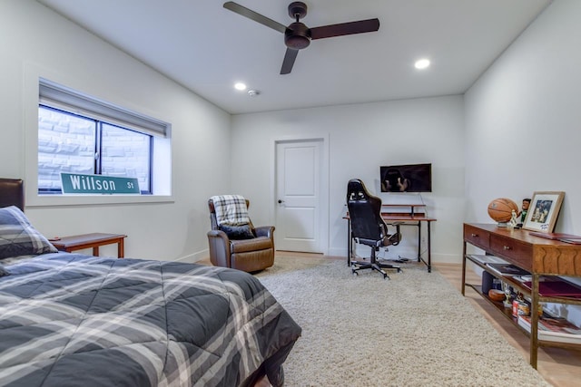 bedroom with hardwood / wood-style flooring and ceiling fan