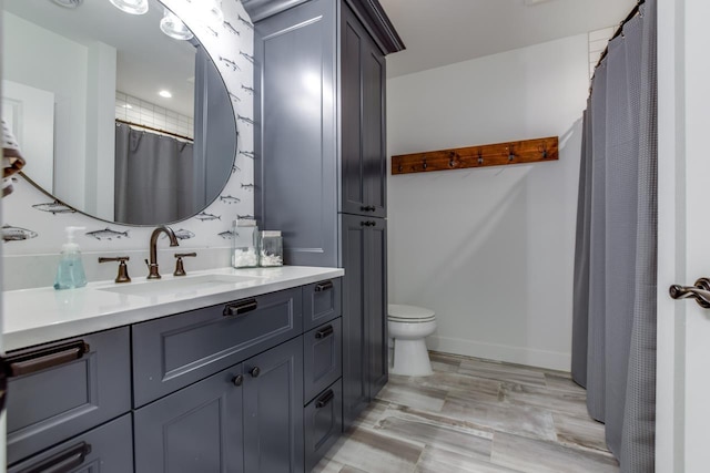 bathroom with vanity and toilet