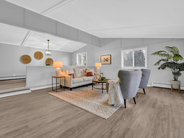 living room with vaulted ceiling with beams, hardwood / wood-style flooring, a notable chandelier, and a baseboard heating unit