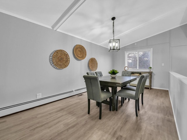 dining space featuring vaulted ceiling, a baseboard heating unit, an inviting chandelier, and light hardwood / wood-style floors