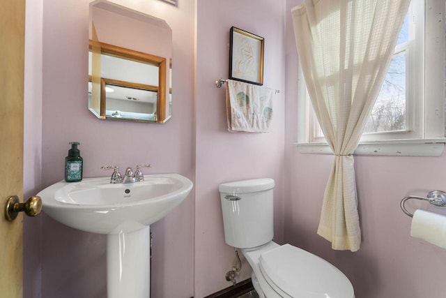 bathroom with sink and toilet