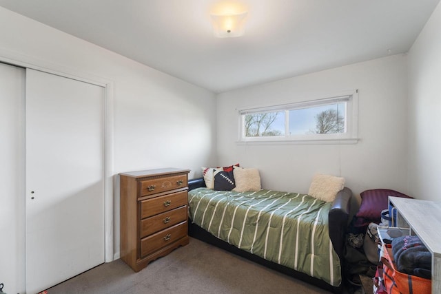 carpeted bedroom featuring a closet