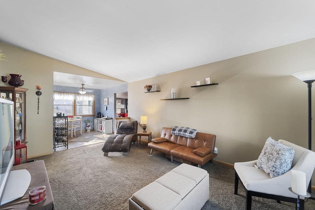 living room featuring vaulted ceiling, ceiling fan, and carpet floors