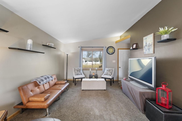 carpeted living room with lofted ceiling