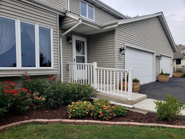 doorway to property featuring a garage