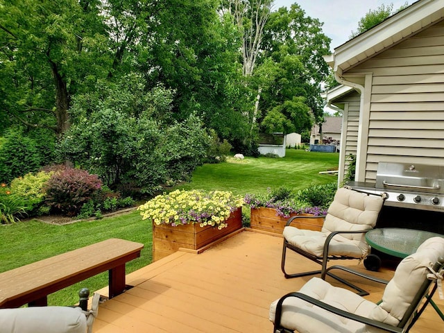 wooden deck with a lawn