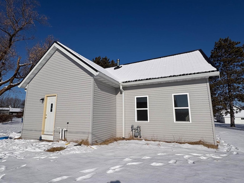 view of snow covered house