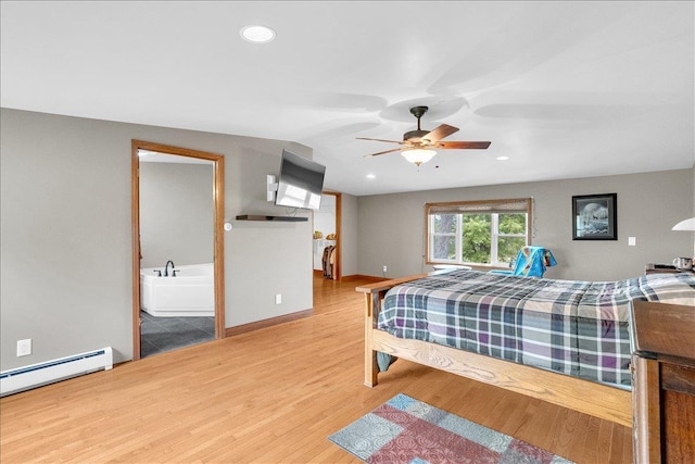 bedroom with ensuite bathroom, hardwood / wood-style floors, a baseboard radiator, lofted ceiling, and ceiling fan