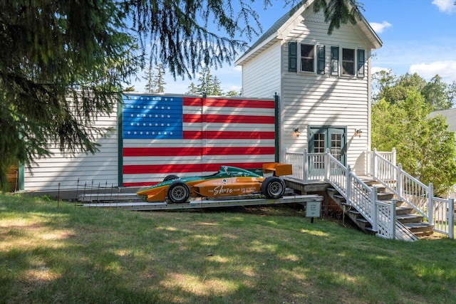 back of house featuring a yard