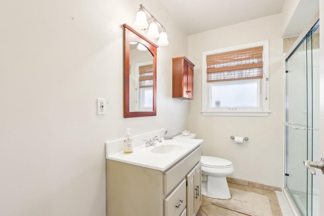 bathroom featuring vanity, a wealth of natural light, an enclosed shower, and toilet