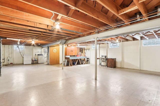 basement with washer / clothes dryer and a healthy amount of sunlight