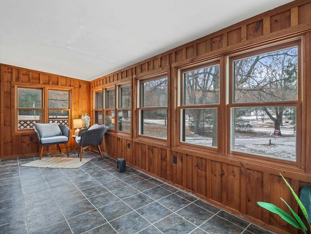 unfurnished sunroom with vaulted ceiling