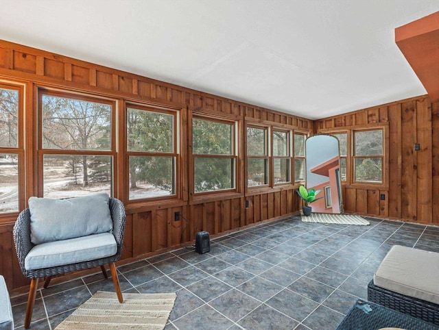 sunroom / solarium featuring lofted ceiling