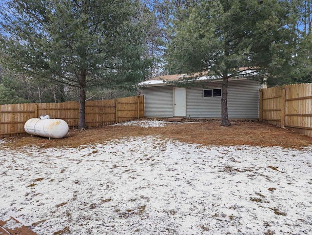 yard covered in snow featuring an outdoor structure