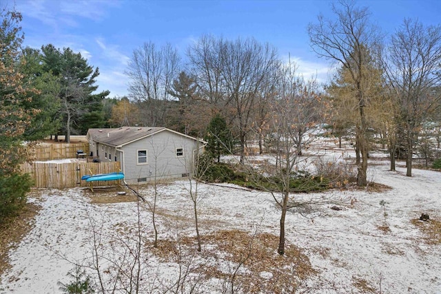 view of yard layered in snow