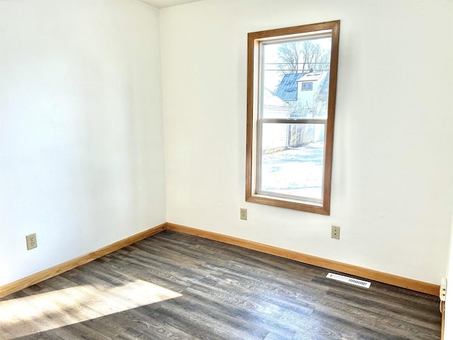 empty room featuring dark hardwood / wood-style floors