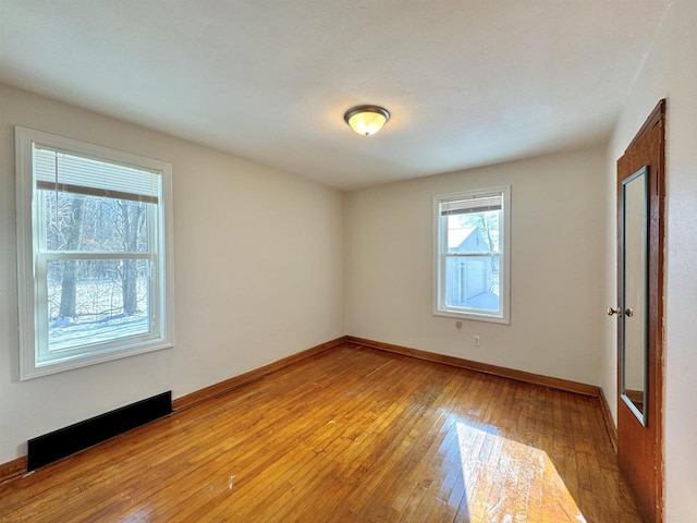 spare room featuring light hardwood / wood-style flooring