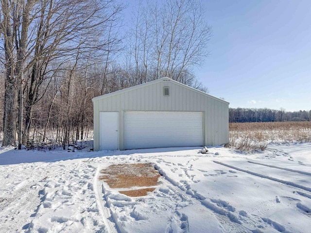 view of snow covered garage