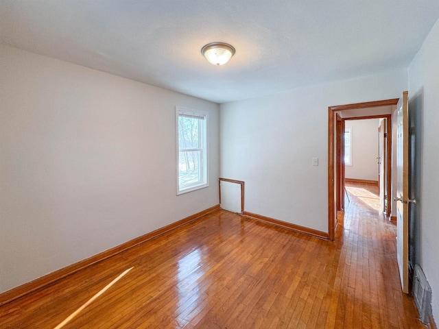 spare room with light hardwood / wood-style floors