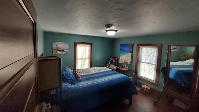 bedroom with wood-type flooring