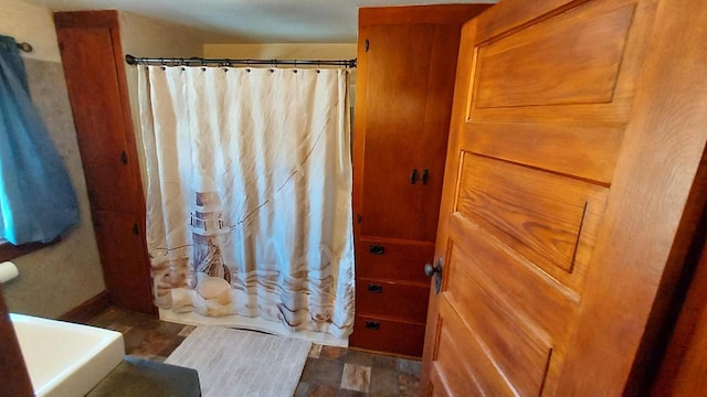 bathroom with a shower with shower curtain