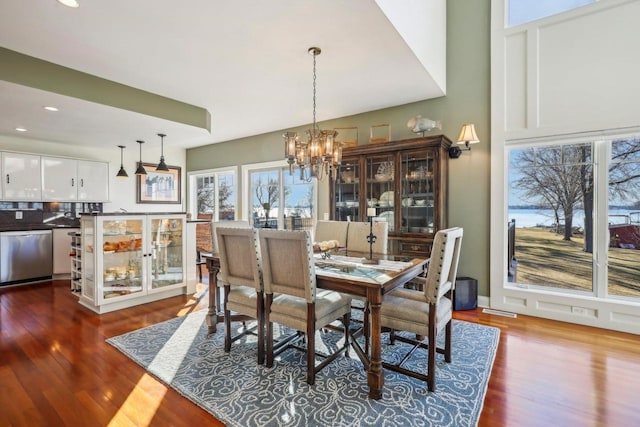 dining room featuring a notable chandelier and hardwood / wood-style floors