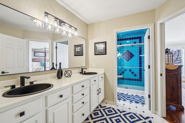 bathroom with vanity and a shower with door