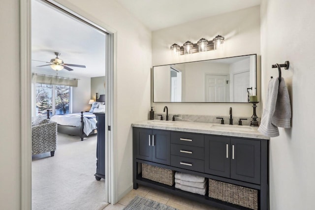 bathroom featuring ceiling fan, tile patterned floors, and vanity