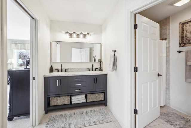 bathroom featuring vanity and tile patterned flooring