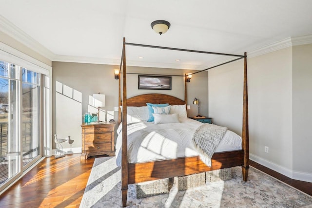 bedroom featuring hardwood / wood-style flooring and crown molding