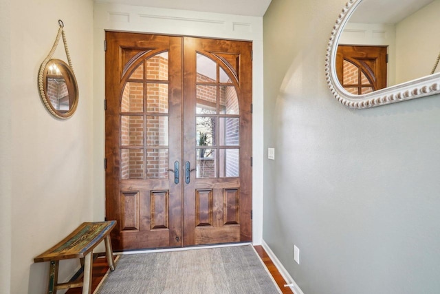 entrance foyer featuring hardwood / wood-style flooring and french doors