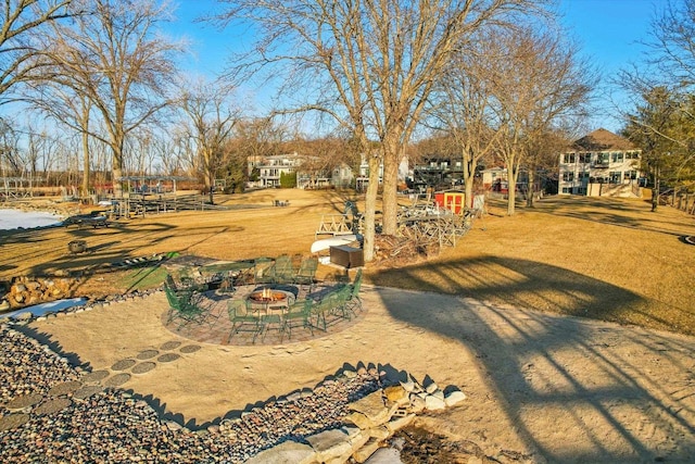 view of yard featuring a patio area and a fire pit