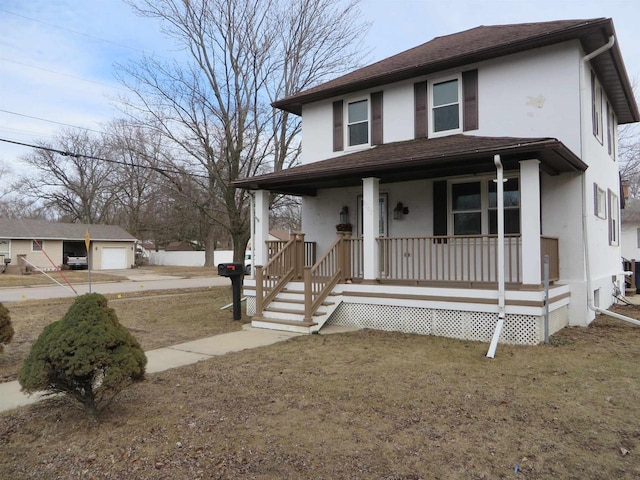 view of front of house with a garage, a front lawn, and a porch