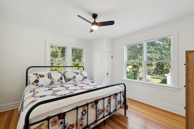 bedroom featuring wood-type flooring and ceiling fan