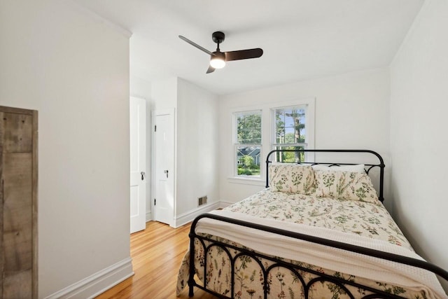 bedroom featuring hardwood / wood-style flooring and ceiling fan