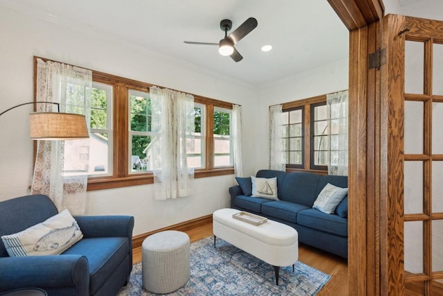 interior space featuring ceiling fan, ornamental molding, and hardwood / wood-style floors