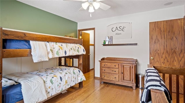 bedroom featuring light hardwood / wood-style floors and ceiling fan