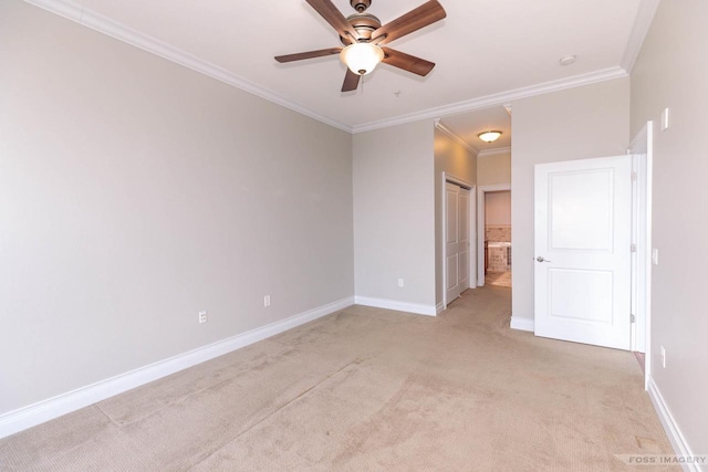 empty room with light carpet, ornamental molding, and ceiling fan