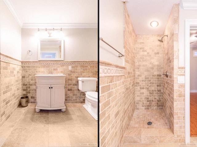 bathroom with crown molding, tile walls, tiled shower, vanity, and toilet